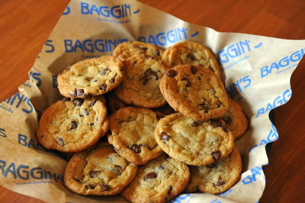 A basket of stacked chocolate chip cookies