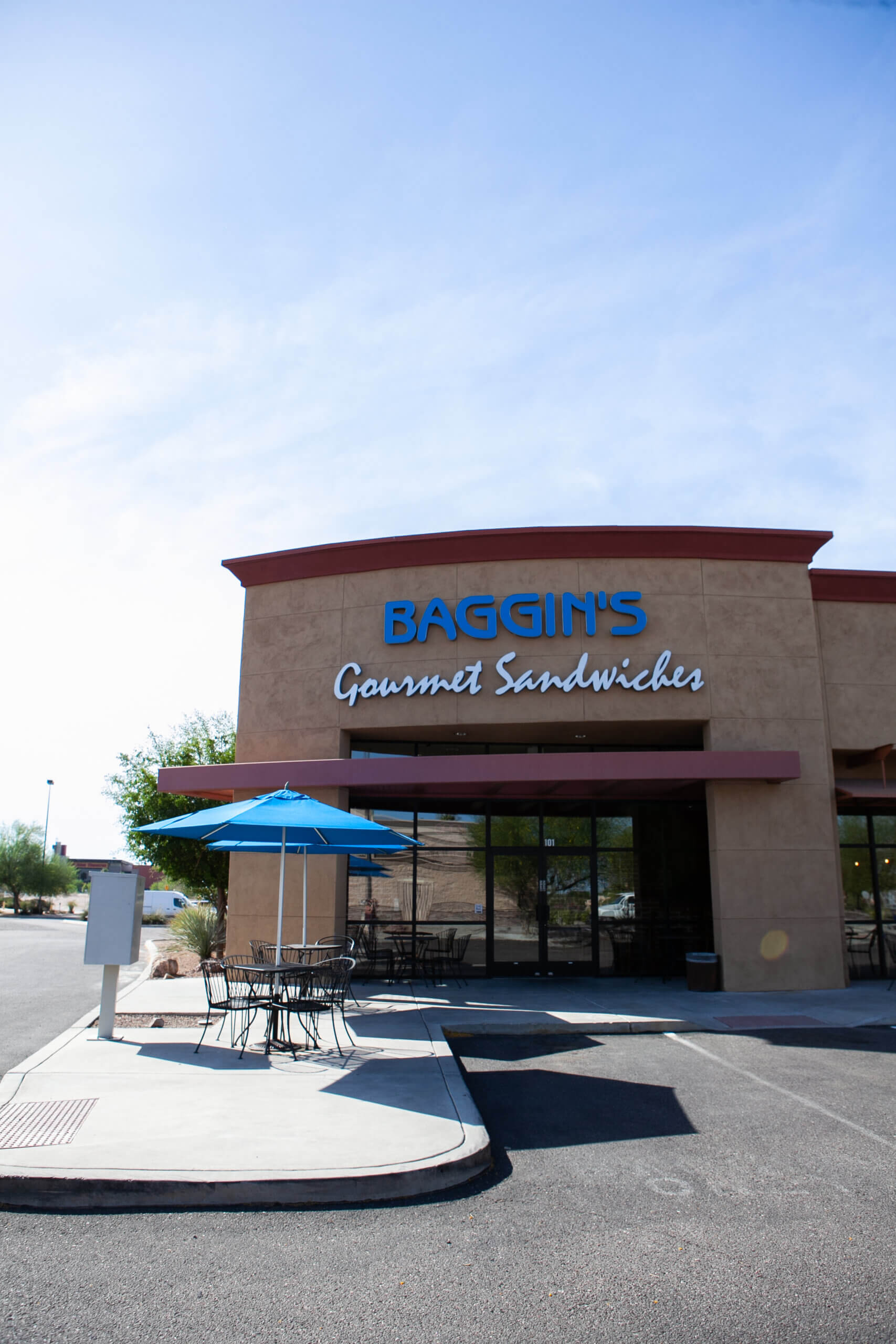 The exterior storefront of Baggin's Gourmet Sandwiches in Tucson